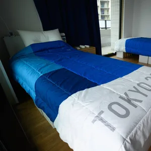 Betten in einem Zimmer vom Olympischen Dorf
