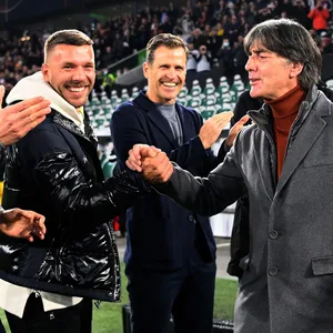 Lukas Podolski und Joachim Löw