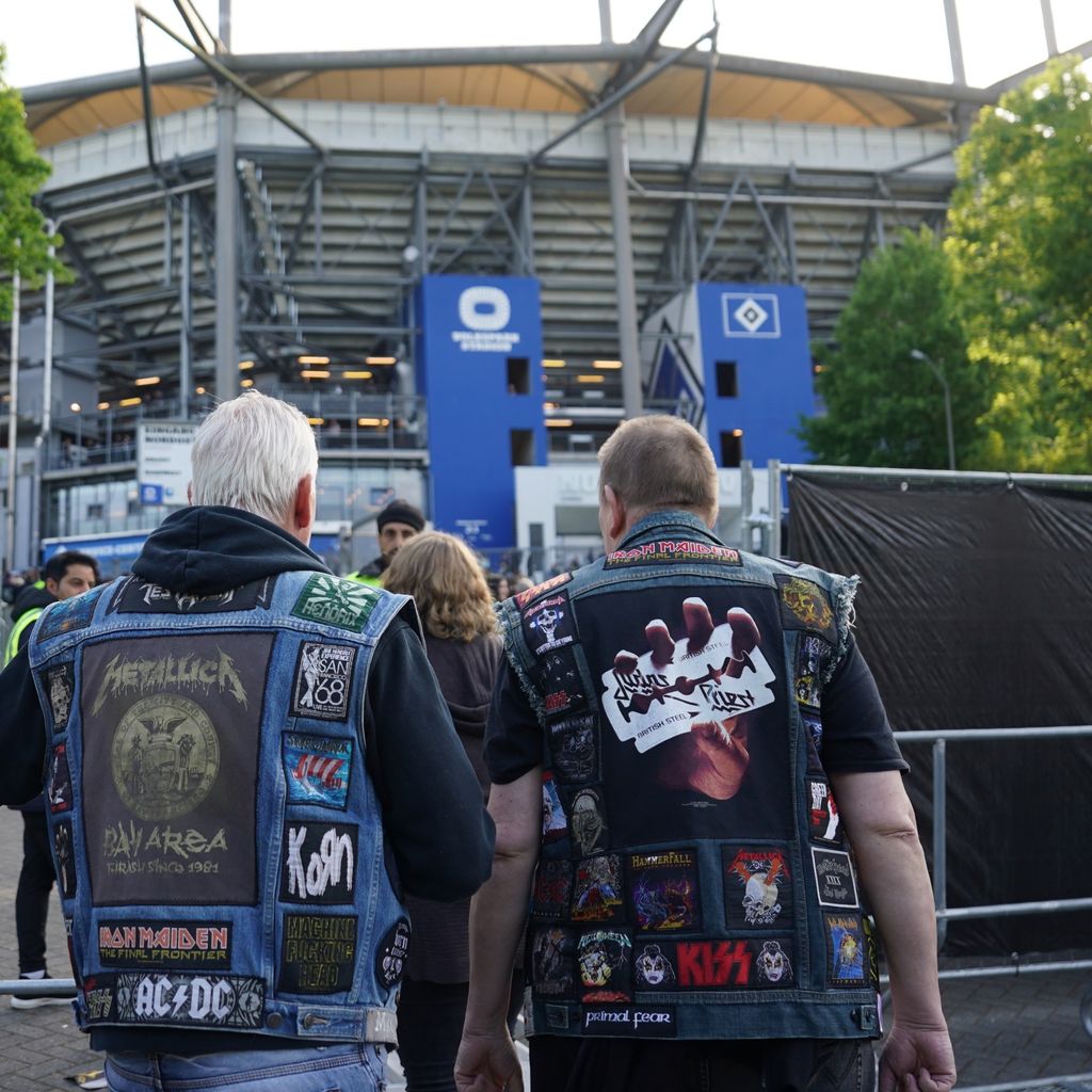 Buddies in frocks: Two Metallica fans on their way to the stadium.