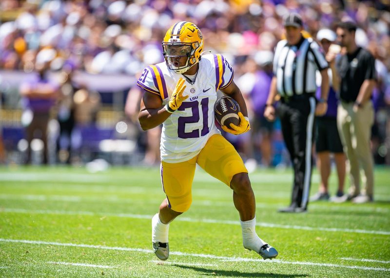 Noah Cain runs with the football