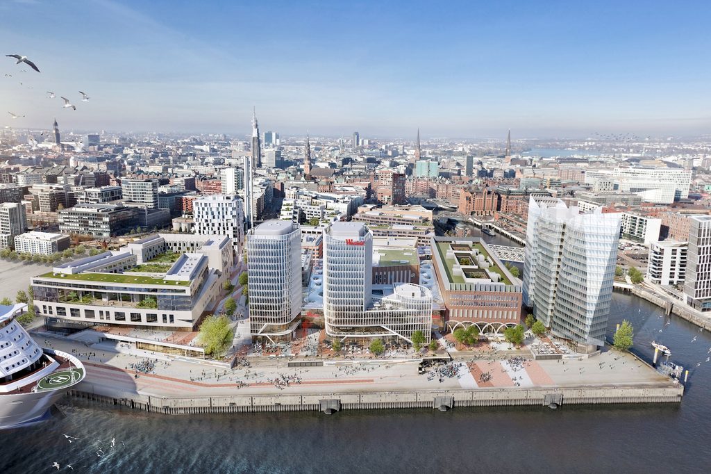 Eine Visualisierung von der Hafencity, am Hafen steht das Übersseequartier mit gläsernen Hochhäusern und steinernen flacheren Gebäuden.