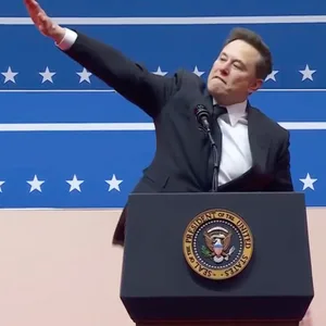 Elon Musk mit gehobenem rechten Arm