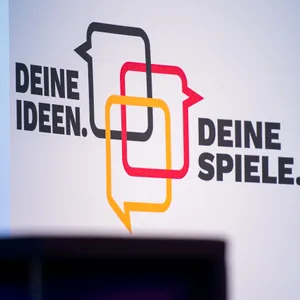 Ein Plakat mit der Aufschrift „Deine Ideen, deine Spiele“