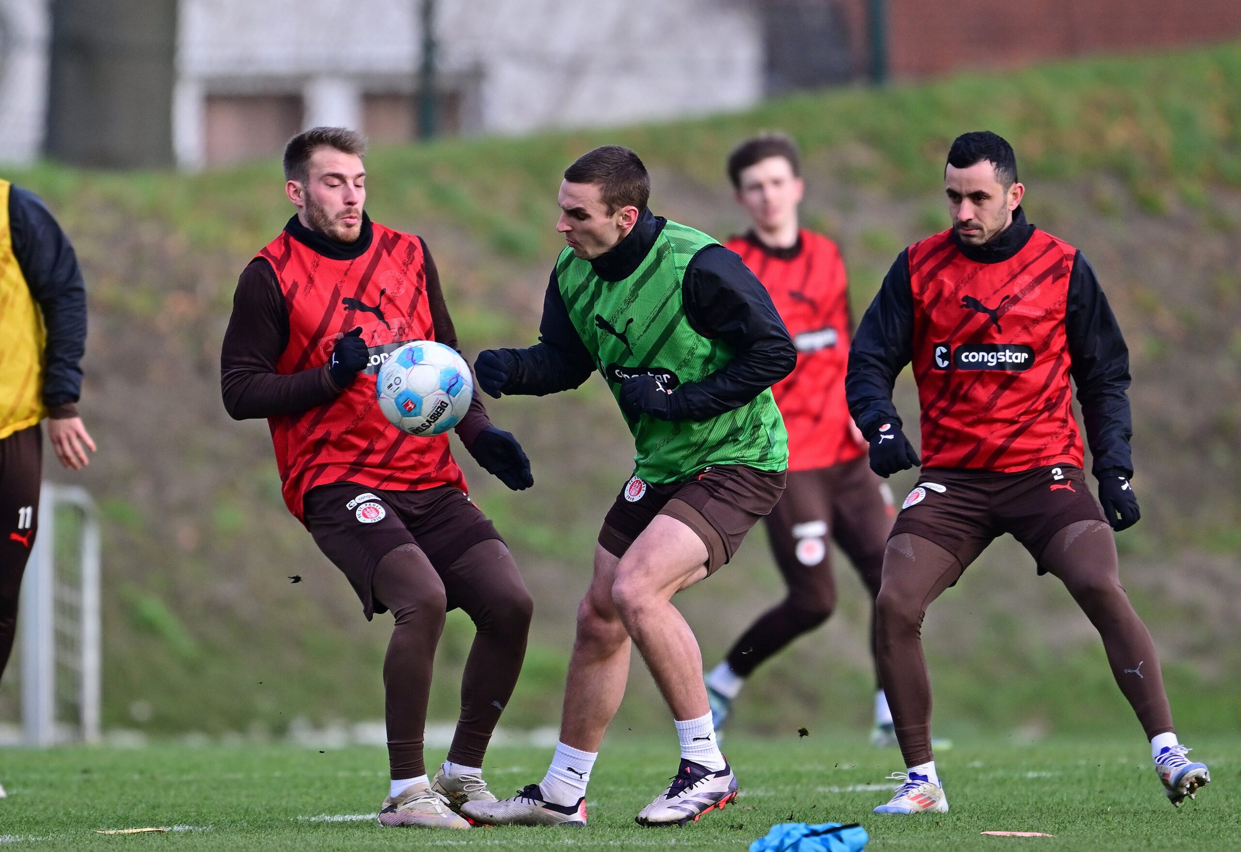 Lars Ritzka, James Sands und Manos Saliakas beim Training