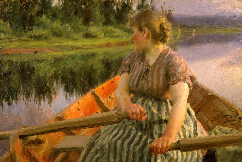 Eine Frau im Ruderboot