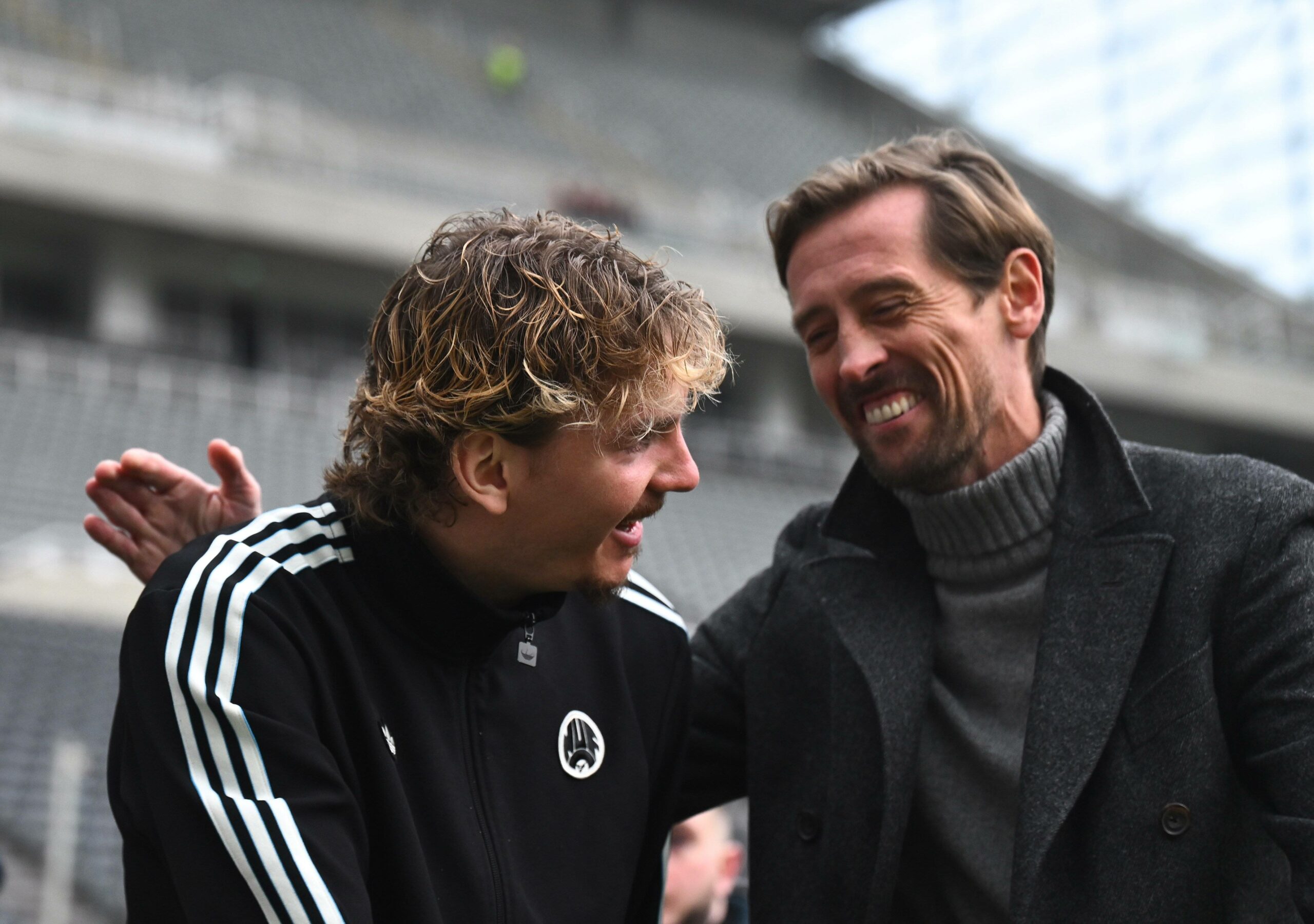 Nick Woltemade lacht mit Peter Crouch