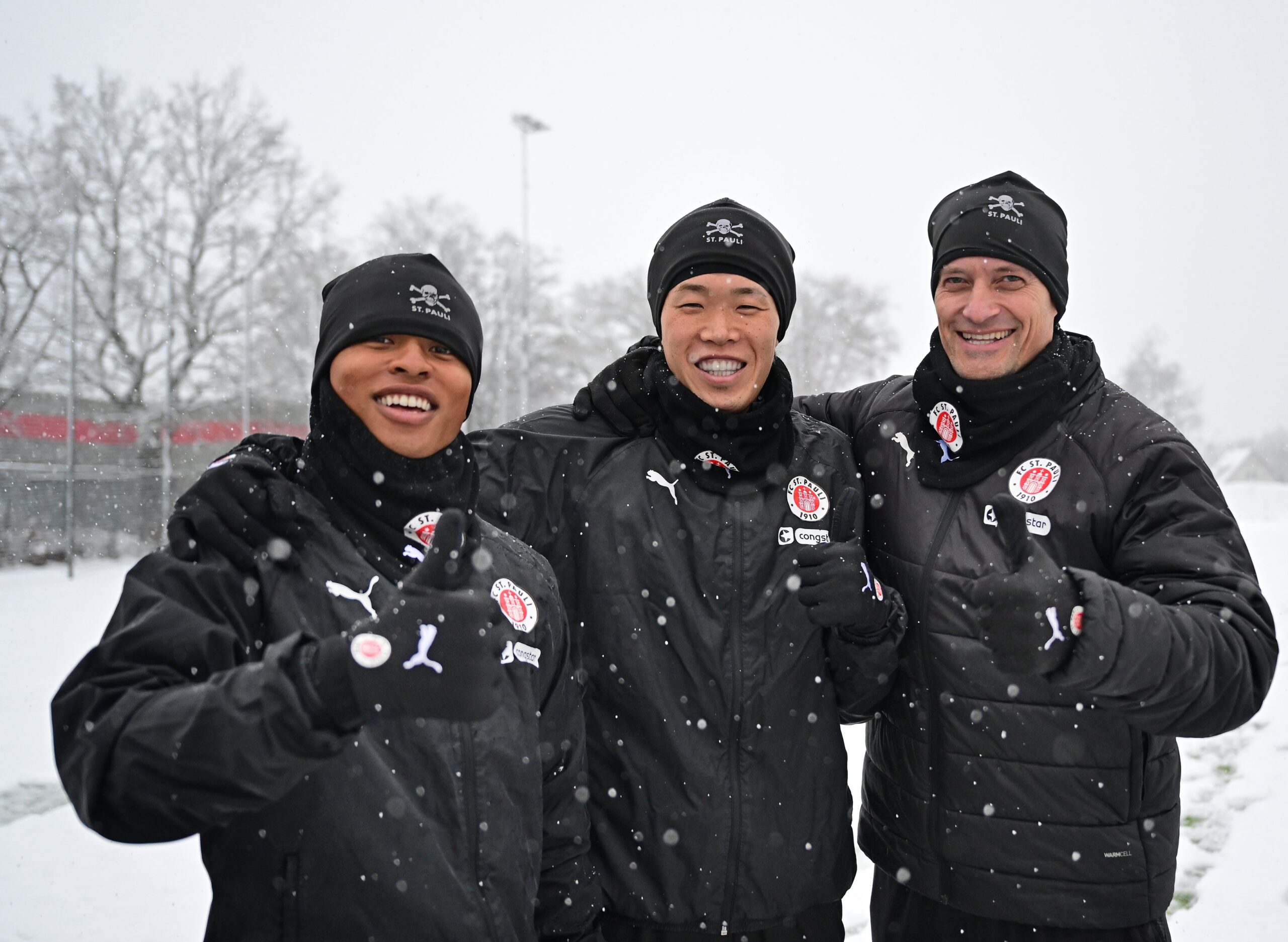 Joel Chima Fujita, Tomoya Ando und Alex Blessin im Schnee