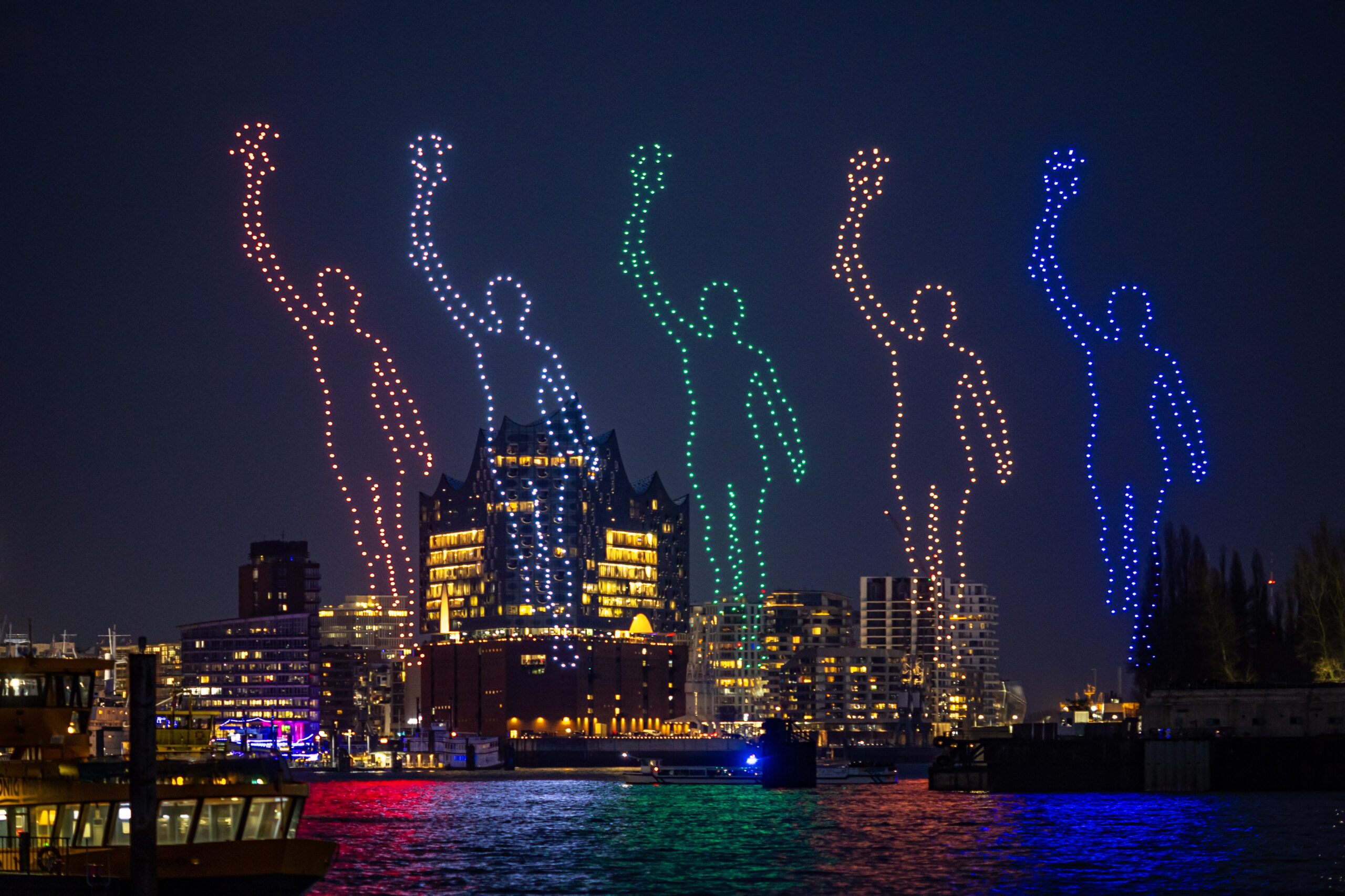 Drohnen bilden die bunten Figuren von Läufern.